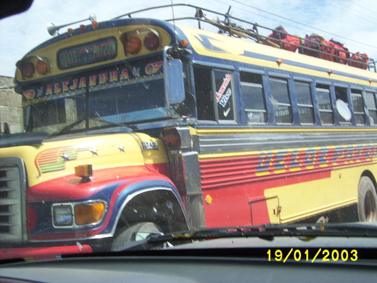 ...baggage goes on top and is unloaded by the bus attendant to make sure that it is claimed by the right owner...