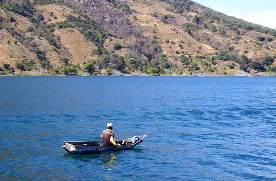 ...sudden and violent storms often hit Lake Atitlan. They don't deter fisherman from going way out in tipsy boat...