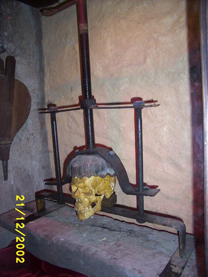 ...and behind a torture chamber was discovered with various instruments like a nail chair and this skull crusher...