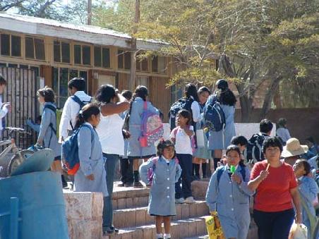 Pupils coming out of school in the middle of the afternoon