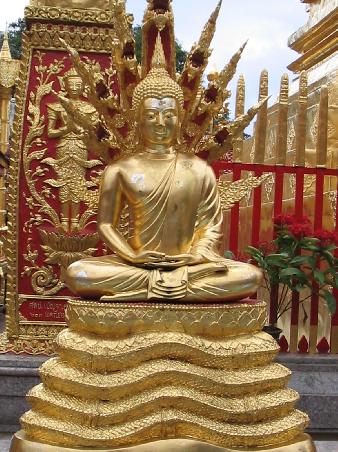 One of the many buddhas surrounding the golden chedi at Doi Sutep.
