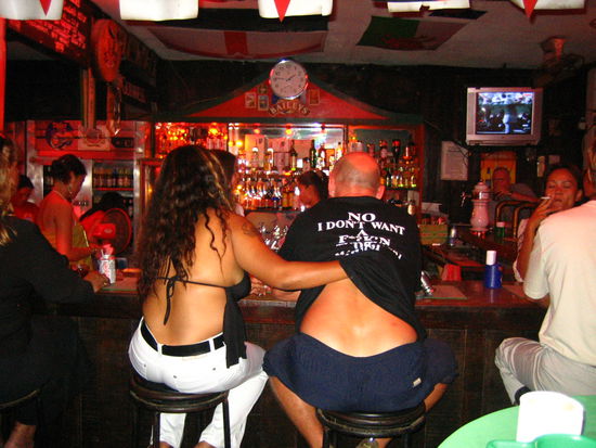 A bar girl works her charm on a farang