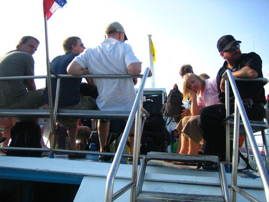 The deck was jam-packed with people and luggage