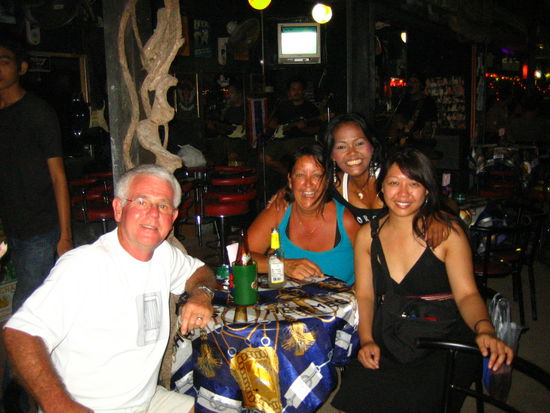 Us with the Thai bar waitress-- very sweet, but we couldn't understand a word she said