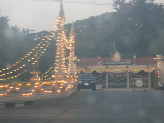 We pass by the King's Palace, which is an entire square decorated with lights all around