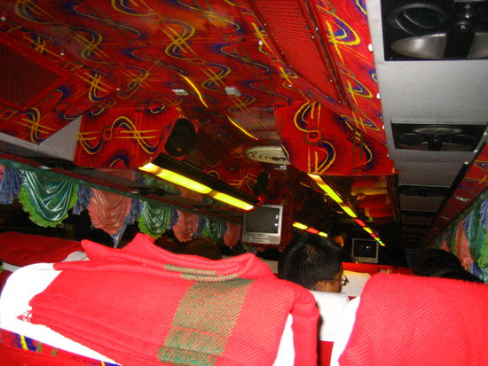 Our luxurious A/C VIP bus, adorned with tacky curtains