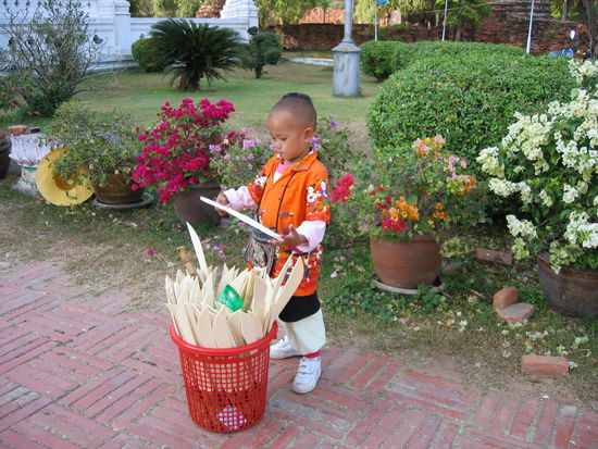 This cute kid was standing out front selling wooden swords