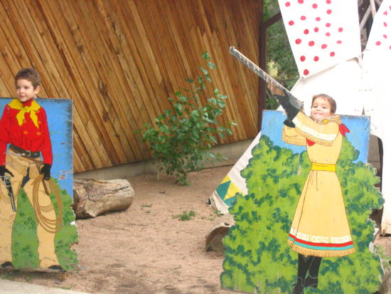 The cute little boy that took a picture of us, then demanded we take a picture of him (he's the one wearing the dress)