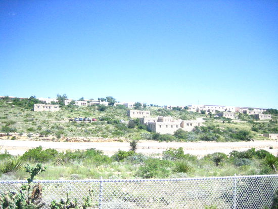The caverns are below these houses