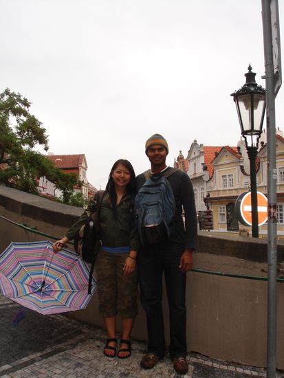 Love the umbrella...and the backpack in front that screams 'I'm a tourist!'