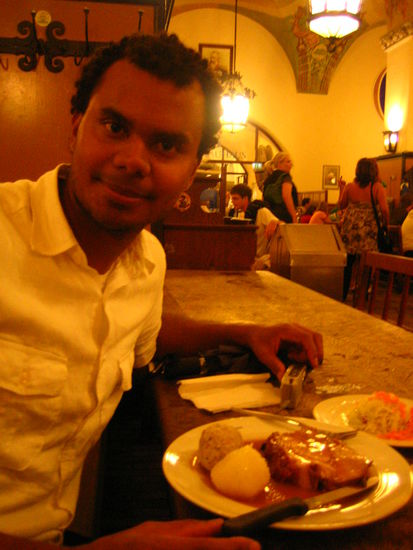 Adam digs into his pork