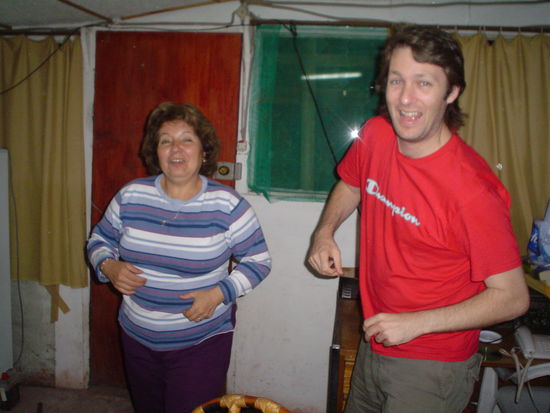 Tia Gaby showing Julito how it is done.