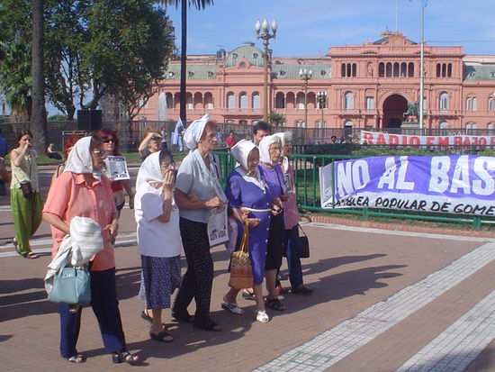 The mothers wear kerchiefs on their heads with the name and details of their missing children embroidered in blue.  They also wear the pictures of their children around their necks usually with the words ¨¿dónde están?¨ or ¨Where are they?¨