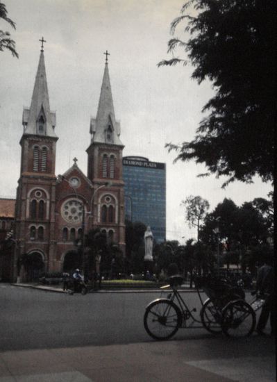 The Notre Damme Cathedral with a Cyclo parked in front.