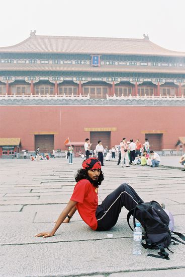 The Indian Contractor sits dejected at the Tiananmen Square.