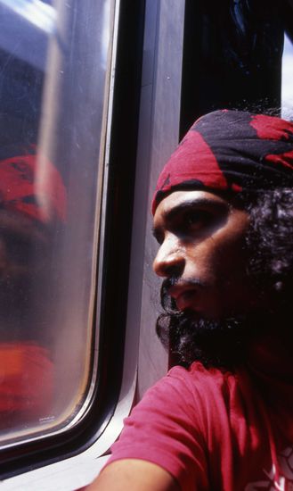 Self portrait done using the seat in front as a camera support.. On the train from Danang to Hanoi.