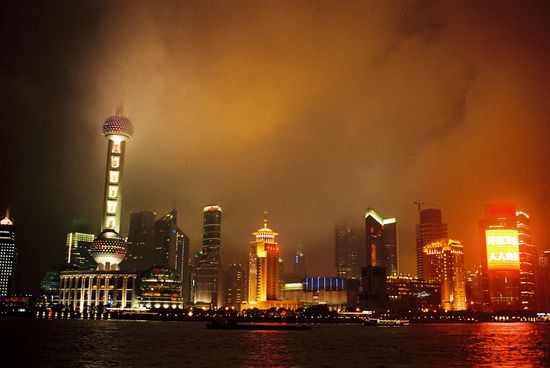 The Shanghai Skyline. Those are rain clouds.. Not Buildings on fire..