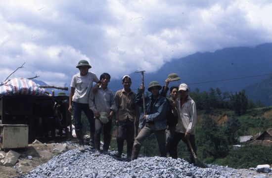 Vietnamese workers wave hi to the Indian Contractor!