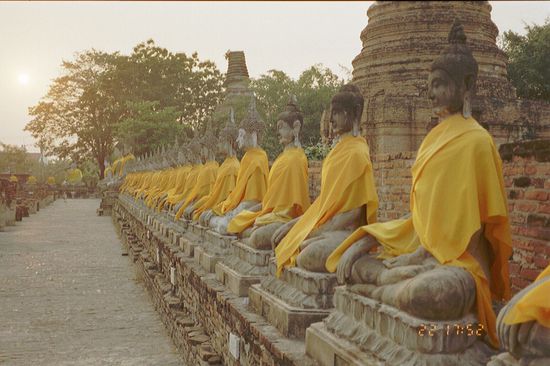 Buddha images, decorated with monk garments, in the (in my opinion) most beautiful temple of Ayutthaya:
Wat Yai Chai Mongkhon.