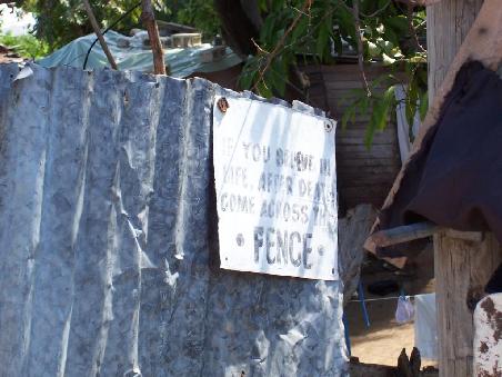 A warm welcome, the sign says: If you believe in life after death come across the fence!