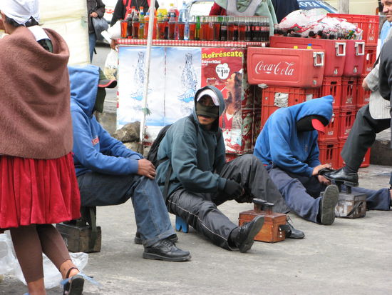 Shoe cleaners in their typical working dress (looks a bit scary ...).