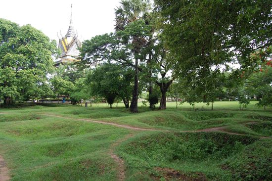 Excavated mass graves at Chong Euk, visible by crater-like holes in the ground