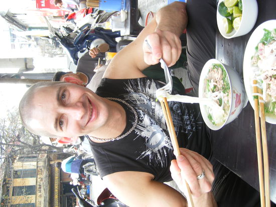 Peter enjoys his first bowl of Pho, Vietnam's most famous dish.