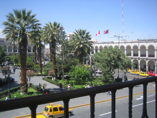 The beautiful Plaza de Armes in Arequipa with colonades on three sides.
