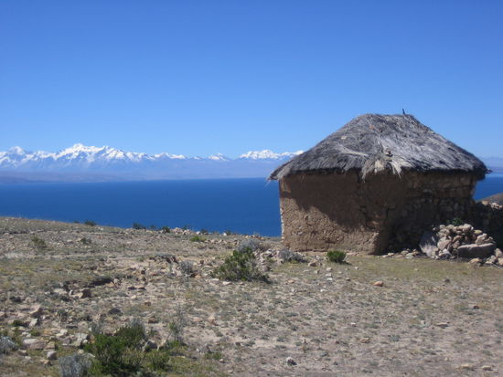 View over the lake to snow covered mountains in Bolivia.