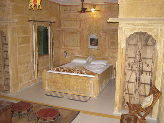 Nice room in The Blue House Guest House - bed made of sandstone