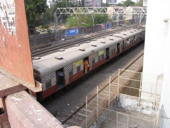 Mumbai commuter train without doors and during this time not crowded