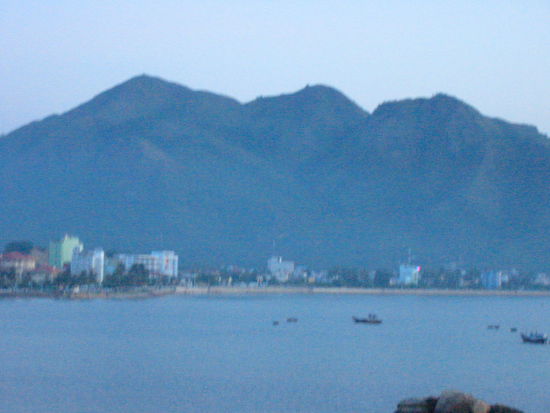 Nha Trang "fairy mountain" with the beach and Tran Phu street in the foreground.