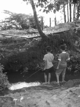 2 indigenous kids fishing