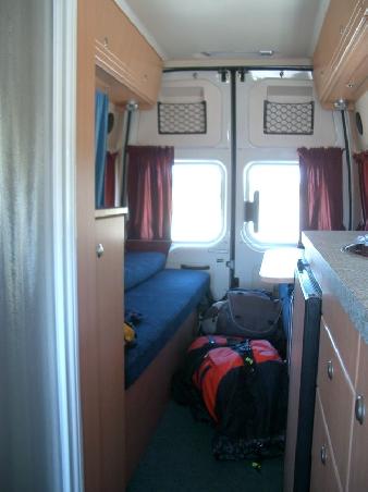 our luxury KEA-camper:
shower and toilet on left, beds in back (fold out) and fridge and kitchen on the right