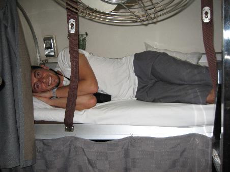 That is a smile of hysteria at the thought of a 14hr train journey squashed in that bed!