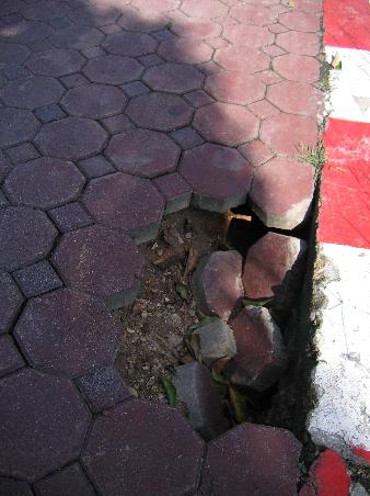 A prime example of the huge gaping holes found in the sidewalk