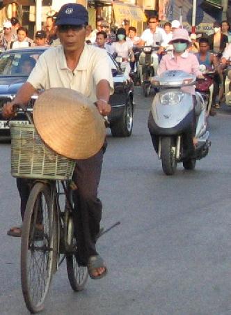 Okay, he's not actually WEARING the pointy hat, but you'll see how it also makes a GREAT bicycle accessory.