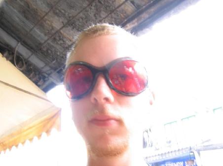 Mat pondering the existence of these ridiculous sunglasses.
(Not an hour later, we actually saw someone wearing them. That's Khao San Road for ya)